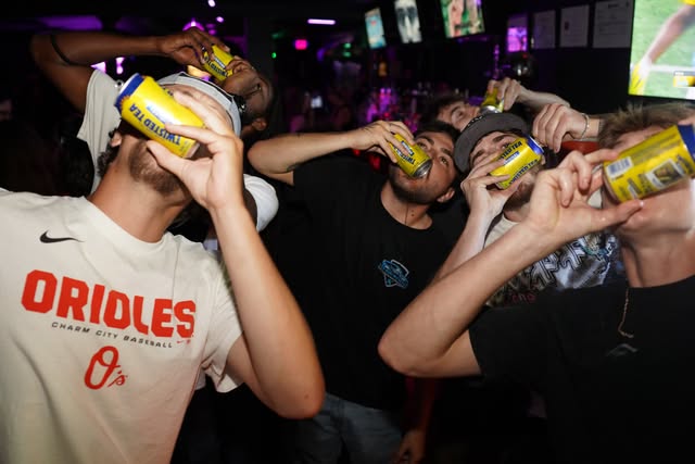Group shotgunning cans together